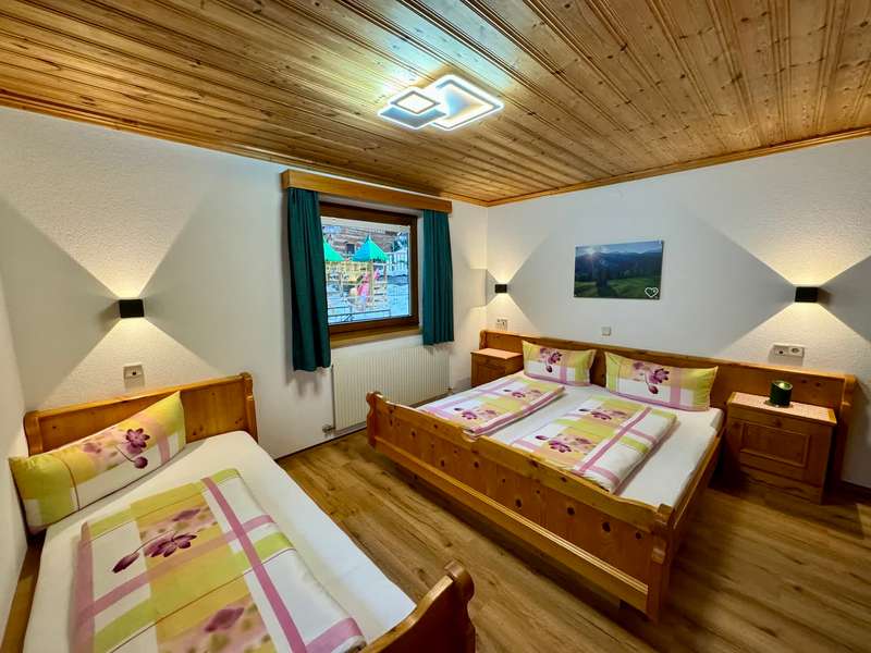 Bedroom with double bed and single bed